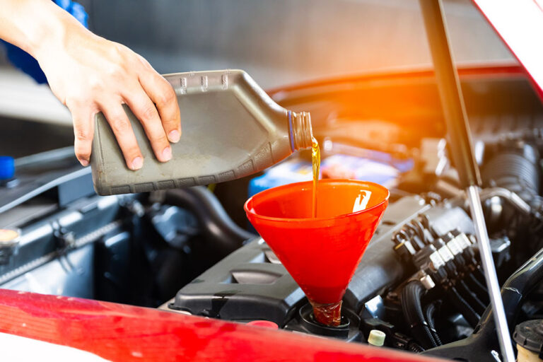 Refueling and pouring oil quality into the engine motor car Transmission and Maintenance Gear.Energy fuel concept